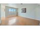 Spacious living room with hardwood floors and a large window at 1810 N Decatur Blvd # 201, Las Vegas, NV 89108