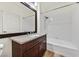 Bathroom with a combination tub and shower, granite countertop, and vanity at 1830 N Buffalo Dr # 2106, Las Vegas, NV 89128