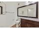 Bathroom featuring a granite countertop, large mirror, and modern fixtures at 1830 N Buffalo Dr # 2106, Las Vegas, NV 89128
