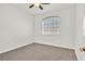 Neutral bedroom with a ceiling fan and a window providing natural light at 1830 N Buffalo Dr # 2106, Las Vegas, NV 89128