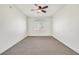 Bright bedroom featuring neutral carpet, ceiling fan, and window with natural light at 1830 N Buffalo Dr # 2106, Las Vegas, NV 89128