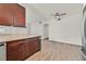 Open floor plan features updated kitchen cabinets, countertop and flooring at 1830 N Buffalo Dr # 2106, Las Vegas, NV 89128