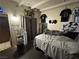 A tidy bedroom features laminate floors, neutral walls, and a comfortable double bed at 2043 Donna St, North Las Vegas, NV 89030