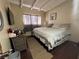 Comfortable bedroom with a window, neutral walls, and laminate floors at 2043 Donna St, North Las Vegas, NV 89030