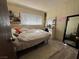 Cozy bedroom with neutral walls, window, and laminate floors, creating a serene and inviting atmosphere at 2043 Donna St, North Las Vegas, NV 89030
