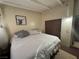 Bedroom featuring a comfy bed, neutral walls, laminate floors, and a window for light and ventilation at 2043 Donna St, North Las Vegas, NV 89030