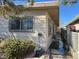 Side view of single story home with a clean exterior and yard at 2043 Donna St, North Las Vegas, NV 89030