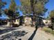 Charming one-story home with a large driveway and mature trees at 2043 Donna St, North Las Vegas, NV 89030