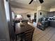 Open living room featuring dining set, tile flooring, and comfortable seating at 2043 Donna St, North Las Vegas, NV 89030
