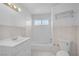 Clean bathroom featuring a tub, vanity, and tile surround at 2229 La Puente St, Las Vegas, NV 89115