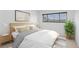 Minimalist bedroom with neutral tones, sleek furniture, and ample natural light at 2229 La Puente St, Las Vegas, NV 89115