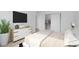 Cozy bedroom featuring a bed, modern dresser, and open closet at 2229 La Puente St, Las Vegas, NV 89115