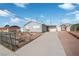 Exterior view of home with a long concrete driveway on a sunny day under a blue sky at 2229 La Puente St, Las Vegas, NV 89115