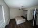 Modest bedroom with hardwood floors, ceiling fan, and doorway to closet space at 2301 Mariposa Ave, Las Vegas, NV 89104