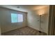 A bright bedroom features a closet and neutral color palette at 2734 Champagne Gold Ave, North Las Vegas, NV 89086
