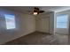 Cozy bedroom with carpet flooring, closet, and a ceiling fan at 2734 Champagne Gold Ave, North Las Vegas, NV 89086