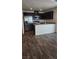 Contemporary kitchen featuring stainless steel appliances, granite counters, and dark cabinetry at 2734 Champagne Gold Ave, North Las Vegas, NV 89086