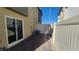 A fenced in patio with brick pavers and exterior access at 2734 Champagne Gold Ave, North Las Vegas, NV 89086