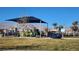 Community playground with shaded play structures and a view of the mountains at 2734 Champagne Gold Ave, North Las Vegas, NV 89086