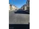 A wide shot of the neighborhood street on a clear day at 2734 Champagne Gold Ave, North Las Vegas, NV 89086