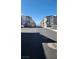 A wide shot of the neighborhood street on a clear day at 2734 Champagne Gold Ave, North Las Vegas, NV 89086