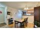 Cozy dining area with wood flooring and a view of the kitchen, great for meals and gatherings at 2750 S Durango Dr # 2012, Las Vegas, NV 89117