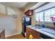 Well-lit kitchen with stainless steel sink, granite countertop, and black refrigerator at 2750 S Durango Dr # 2012, Las Vegas, NV 89117