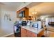 Open concept kitchen with granite countertops and an electric range stove at 2750 S Durango Dr # 2012, Las Vegas, NV 89117