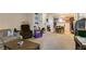 Comfortable living room featuring a sofa, recliner, and a view into the dining and kitchen areas at 2750 S Durango Dr # 2012, Las Vegas, NV 89117