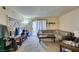 Comfortable living room with modern sofa, balcony access, and tasteful decor at 2750 S Durango Dr # 2012, Las Vegas, NV 89117