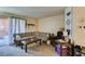 Comfortable living room featuring a sectional sofa, balcony access, and neutral decor at 2750 S Durango Dr # 2012, Las Vegas, NV 89117