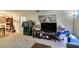Cozy living room featuring neutral walls and carpet, with an entertainment center and a large window at 2750 S Durango Dr # 2012, Las Vegas, NV 89117