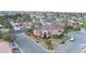 Stunning aerial view of a two-story home with lush landscaping, circular driveway, and a tile roof at 3341 Camino Gardens Way, Las Vegas, NV 89146