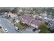 Gorgeous aerial view of a two-story home with a tile roof, a three-car garage and a well-kept lawn at 3341 Camino Gardens Way, Las Vegas, NV 89146