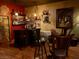 Home bar with a barrel accent, stocked shelves, and seating at the counter at 3341 Camino Gardens Way, Las Vegas, NV 89146