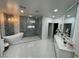Stunning bathroom features a soaking tub, stylish fixtures, and elegant tile work at 3341 Camino Gardens Way, Las Vegas, NV 89146