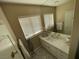 Bright bathroom with a large mirror and geometrically-patterned floors at 3341 Camino Gardens Way, Las Vegas, NV 89146