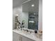 Bathroom vanity features an elegant mirror and a luxurious marble countertop at 3341 Camino Gardens Way, Las Vegas, NV 89146