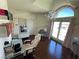 This bedroom has light-colored walls, a chandelier, and sliding glass doors leading to the backyard at 3341 Camino Gardens Way, Las Vegas, NV 89146