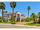 Beautiful two-story home featuring a well-manicured lawn, mature palm trees, and a circular driveway at 3341 Camino Gardens Way, Las Vegas, NV 89146