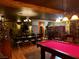 Game room showcasing a pool table, dining table and chairs, and uniquely decorated walls at 3341 Camino Gardens Way, Las Vegas, NV 89146