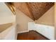 Charming hallway boasts a unique brick ceiling design, white cabinets, and hardwood floors at 3341 Camino Gardens Way, Las Vegas, NV 89146