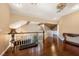 Bright hallway features hardwood floors, a staircase, and a unique brick ceiling design at 3341 Camino Gardens Way, Las Vegas, NV 89146