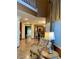 Inviting hallway showcases hardwood floors, elegant decor, and views into other rooms at 3341 Camino Gardens Way, Las Vegas, NV 89146