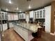 Gourmet kitchen features stone countertops, stainless steel appliances, and hardwood floors at 3341 Camino Gardens Way, Las Vegas, NV 89146