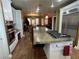 Open-concept kitchen showing a large cooktop island at 3341 Camino Gardens Way, Las Vegas, NV 89146