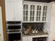 Updated kitchen with stainless steel microwave and oven with custom cabinets and hardware at 3341 Camino Gardens Way, Las Vegas, NV 89146