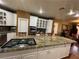 Cooktop island in the kitchen with custom cabinets and hardware at 3341 Camino Gardens Way, Las Vegas, NV 89146