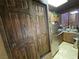 This kitchen features wood cabinets, stainless steel appliances, and sliding closet doors at 3341 Camino Gardens Way, Las Vegas, NV 89146
