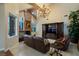 Inviting living room with exposed beams, fireplace, and a wall-mounted television at 3341 Camino Gardens Way, Las Vegas, NV 89146